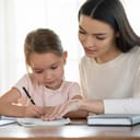 A mother doing homework with her daughter