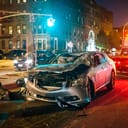 A crashed car on the road after an accident