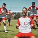Team, success and winner by soccer player celebration during game at soccer field, happy, cheering and victory. Sport, achievement and goal by football team running and celebrating football field win