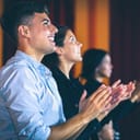 People applauding in the movie theater. Standing ovation.