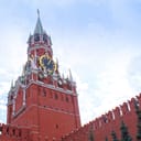 the Spasskaya Tower of the Moscow Kremlin, Russia, with a blue sky background