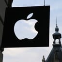 Closeup of an Apple logo sign on a building