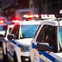 New York NYPD Police car with sirens at day on street