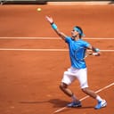 Rafa Nadal serving on clay
