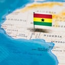Map of west Africa with a small flag pinned to Ghana