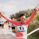 Happy woman completes a marathon