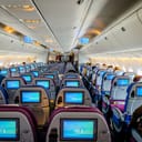 Interior of a mostly-empty plane cabin.