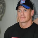 Portrait of wrestler John Cena wearing a cap.