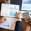 Accountant points to a graph while explaining a tax rule