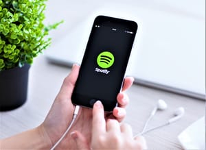iPhone 6 Space Gray with music service Spotify on the screen