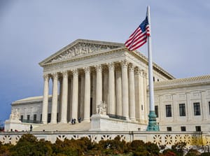 Flag flying at half-mast on the Supreme Court building to pay respect to the late Justice Antonin Scalia.