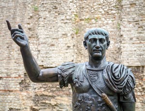 Bronze statue of Emperor Trojan next to the London Wall.