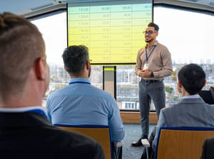 A person giving a business presentation at work.