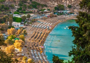Sunny Lindos beach on the island of Rhodes in Greece.