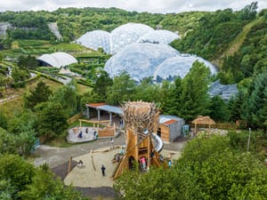 The Eden Project's iconic biomes and a playful outdoor playground area.