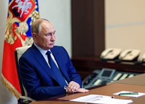 Russian President Vladimir Putin listens to acting Governor of Kursk region Alexei Smirnov during a meeting via videoconference at the Novo-Ogaryovo state residence outside Moscow, Russia, Thursday, Aug. 8, 2024.