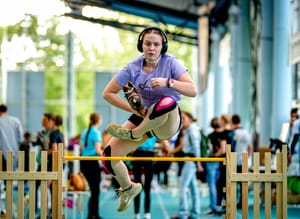 A participant clears the bar during the first German Hobby Horsing Championship in Frankfurt, Germany, Saturday, Sept. 14, 2024. 