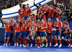 Spain's Alvaro Morata lifts the trophy after winning the final match between Spain and England at the Euro 2024 soccer tournament in Berlin, Germany