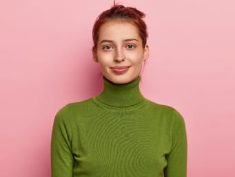 Portrait of beautiful young lady has a dark combed hair.