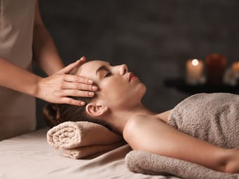Young woman having massage in spa salon