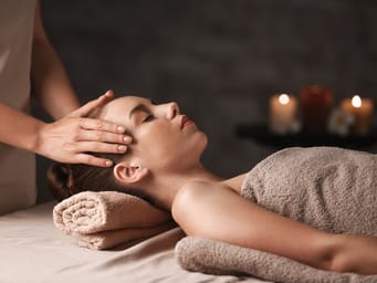 Young woman having massage in spa salon