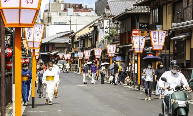 People walk along a street in Gion area, Kyoto, western Japan 