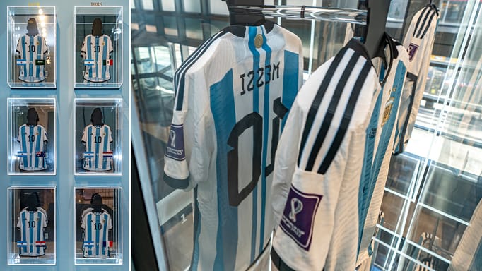 A collection of six shirts, worn by footballer Lionel Messi at the 2022 FIFA World Cup, on display at Sotheby's; A shirt, worn by soccer player Lionel Messi in a match for Argentina against Saudi Arabia in the 2022 FIFA World Cup