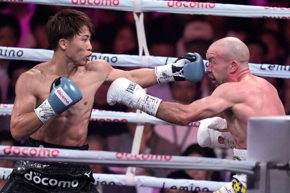Japanese champion Naoya Inoue, left, and Irish challenger TJ Doheny, right, during the first round of a boxing match for the unified WBA, WBC, IBF and WBO super bantamweight world titles in Tokyo, Tuesday, Sept. 3, 2024.

