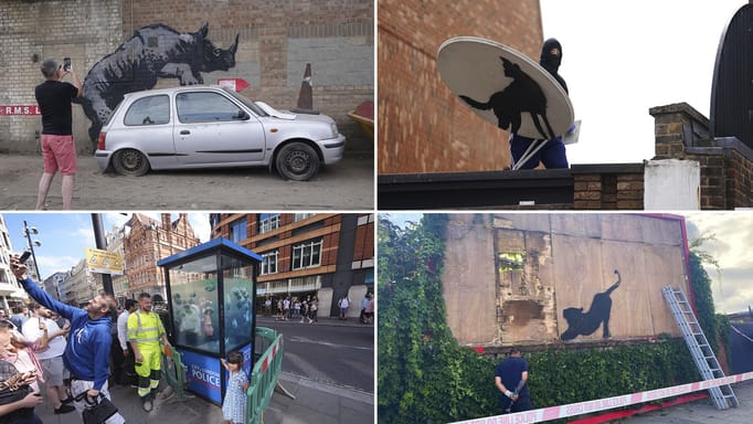 Contractors begin to dismantle a billboard with the new Banksy artwork depicting a stretching cat in Cricklewood, north-west London, Saturday, August 10, 2024. 