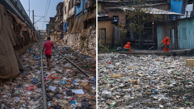 A man walks on a railway track littered with different waste materials; city workers removing garbage floating on the Negro River in Manaus, Brazil.